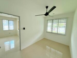Empty white room with a black ceiling fan, tile floor, and a large window; doorway to another sunlit space.