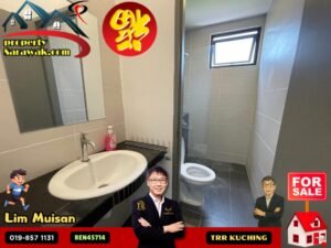 Bathroom with sink, mirror, toilet and glass shower enclosure in a modern tiled room; property listing with sale logos and branding nearby.