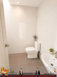 Bright minimalist bathroom with a white toilet and a sink, white tiled walls, and beige floor tiles; small potted plants on the toilet tank and sink.