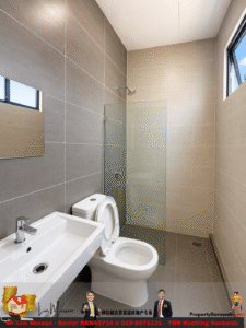 Modern bathroom with beige and gray wall tiles, a glass shower enclosure, a white toilet, and a rectangular sink with chrome faucet in the foreground.