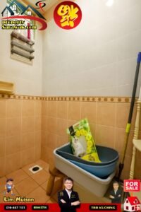 Bathroom corner with a mop bucket and cleaning supplies; promotional property ads and 'FOR SALE' badge in the foreground.