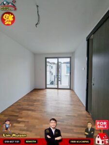 Unfurnished living room with wooden floor, white walls, and a large glass door opening to an outdoor area; ceiling wires hang down for lighting.