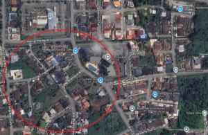 Satellite map with a red circle highlighting a neighborhood area around Lorong Stampin Timor and Jalan Tol JaJa.